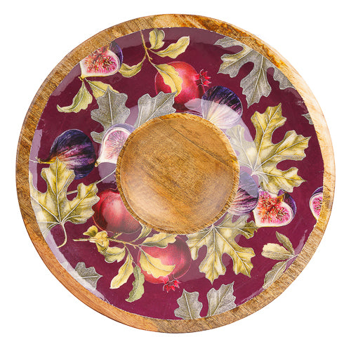 Overhead view of round mango wood chip and dip bowl with central dip compartment and fig and pomegranate pattern.