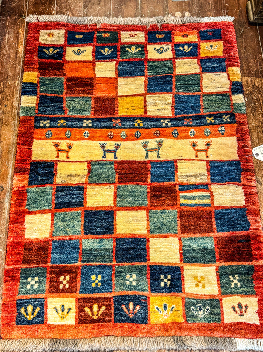 Handwoven Persian Gabbeh Wool Rug 140x100cm Check with motifs and red Rust Border - Multicoloured Traditional Design