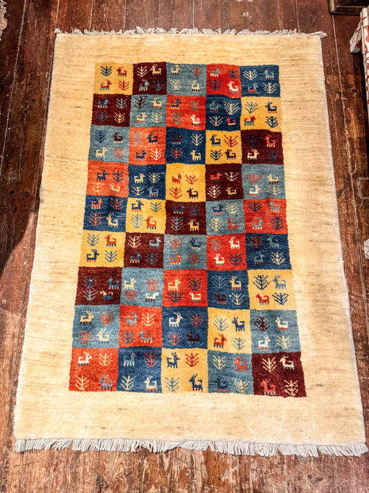 Handwoven Persian Gabbeh Wool Rug 147x105cm Check with motif with cream Border - Multicoloured Traditional Design
